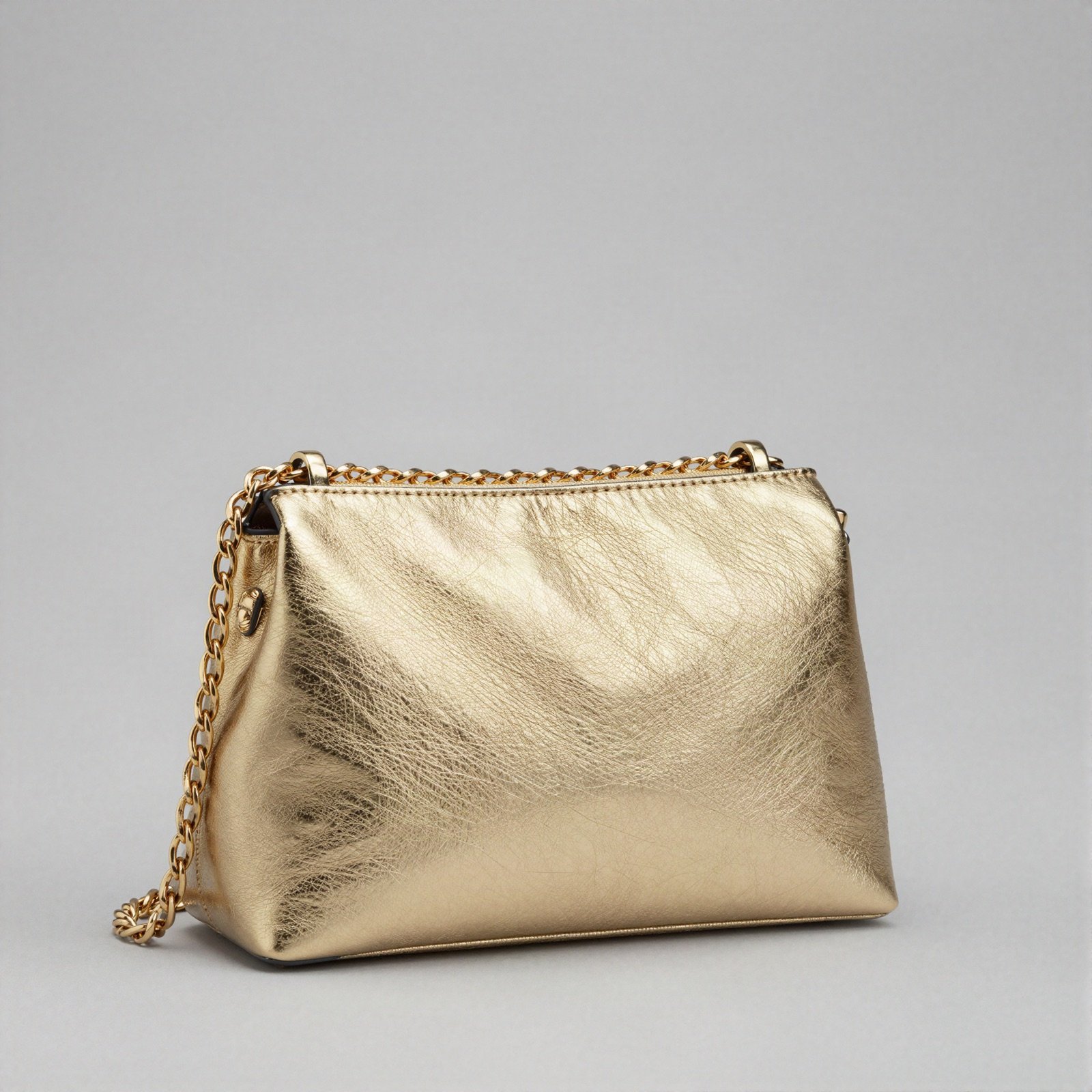 Gold metallic purse with a chain strap