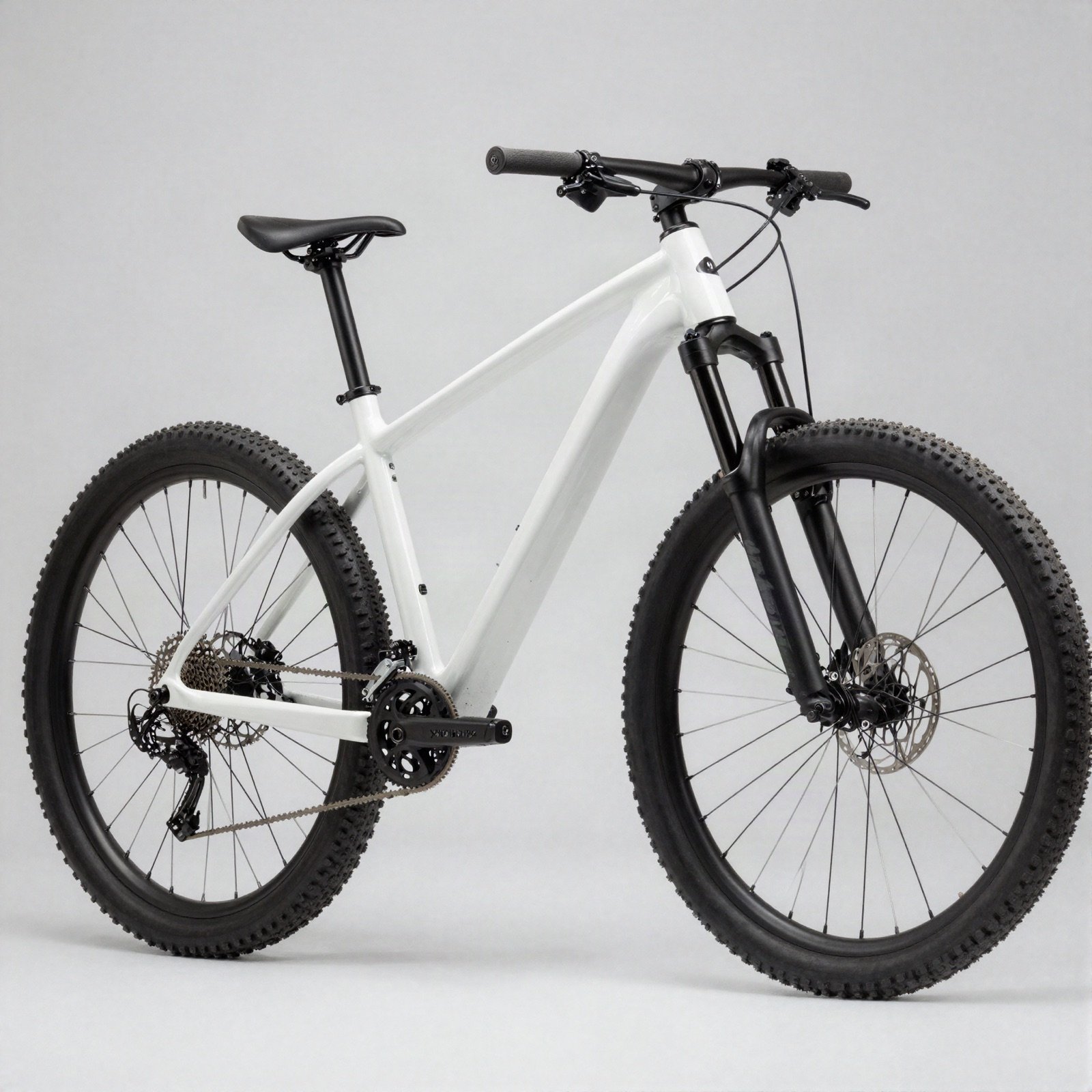 A white hardtail mountain bike with a black suspension fork