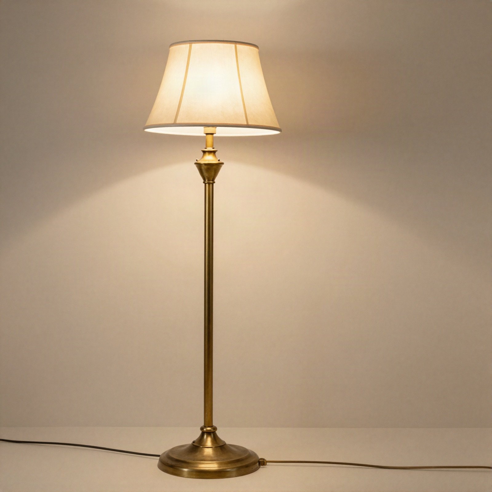 Vintage-style brass floor lamp with a cream fabric shade