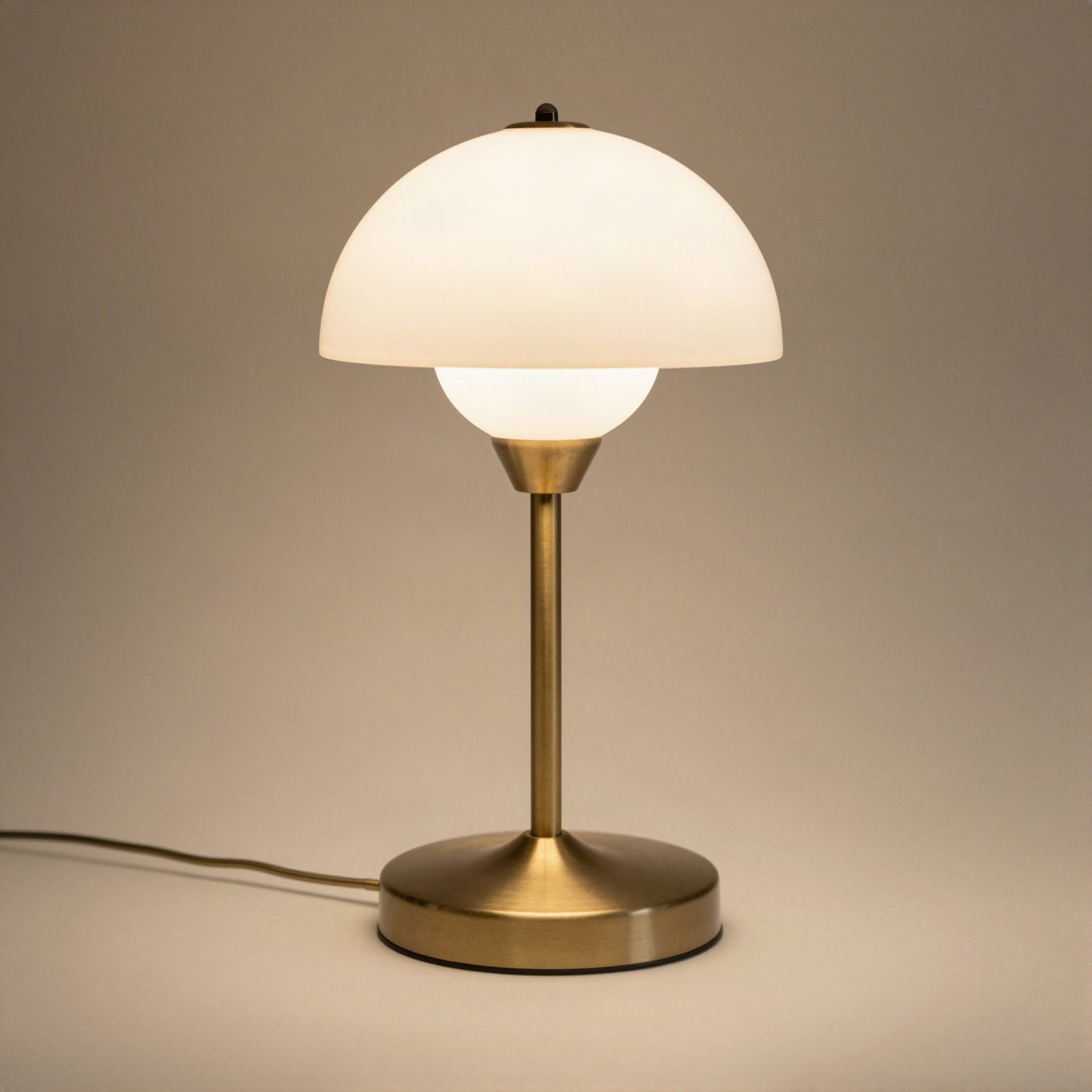Brass desk lamp with a white glass dome shade