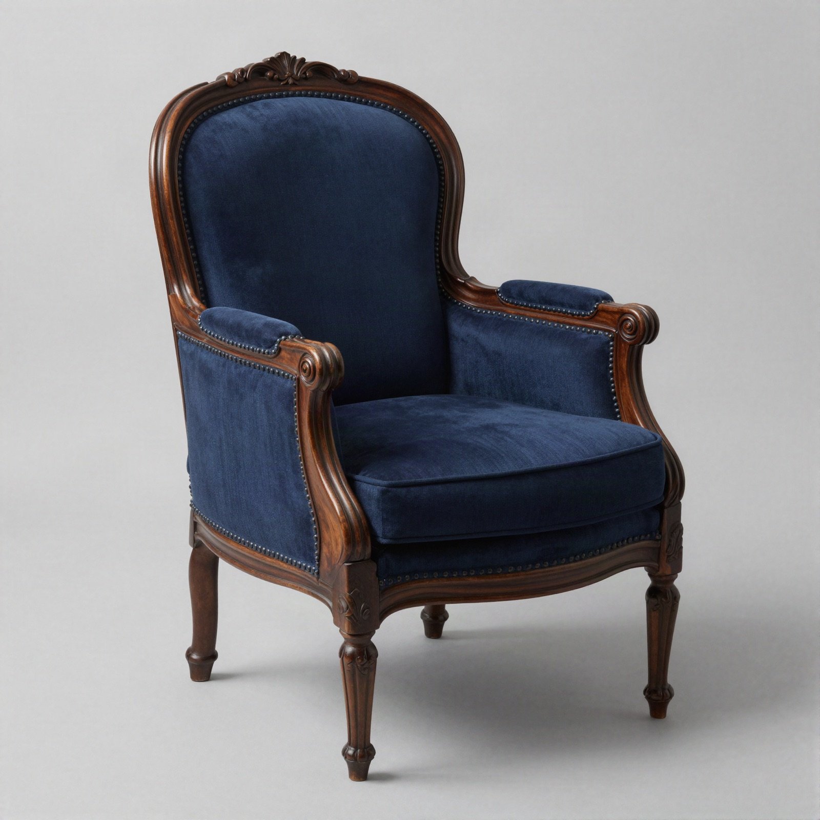 Vintage armchair with carved wood frame and navy upholstery