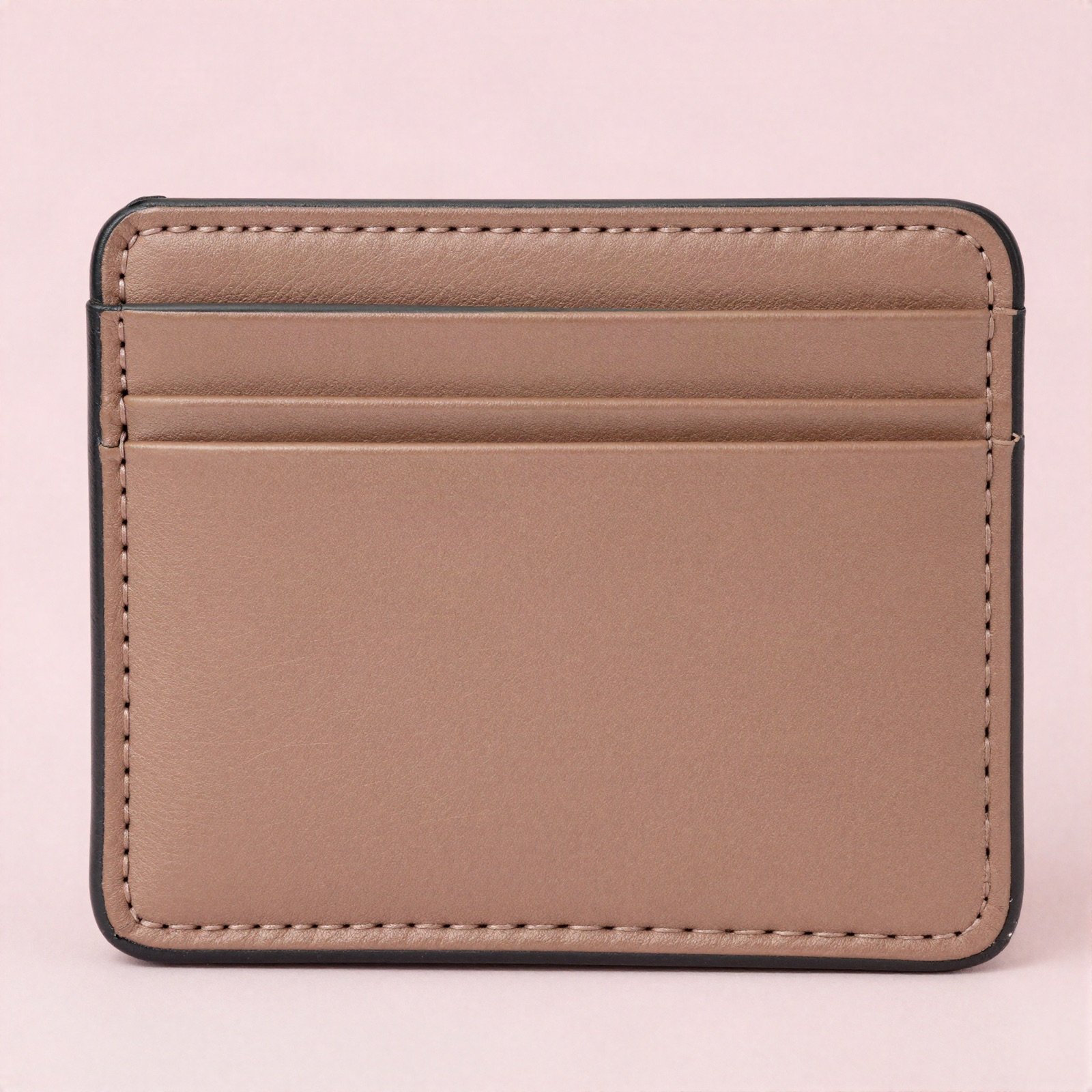 A slim light brown leather credit card case