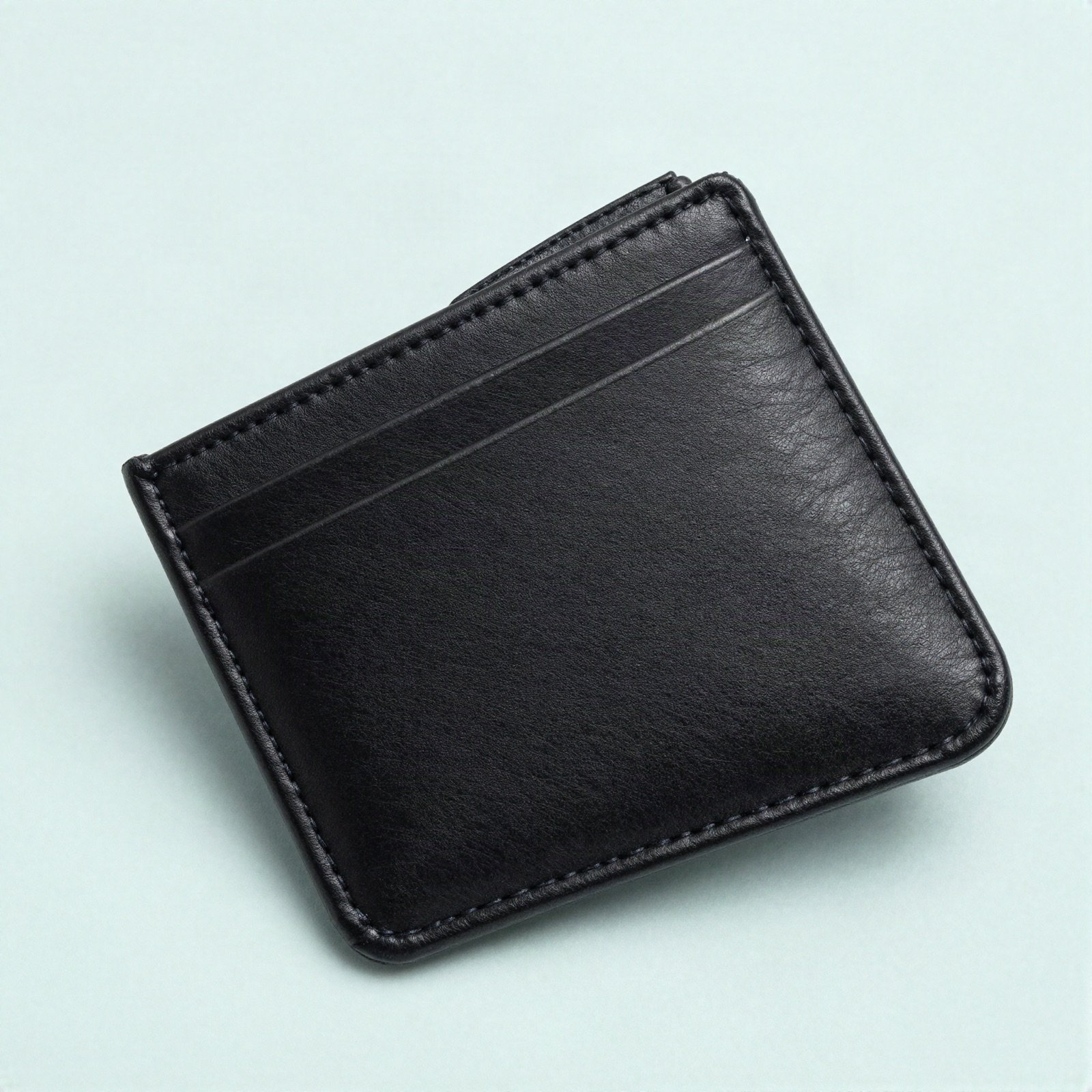 A slim black leather card holder
