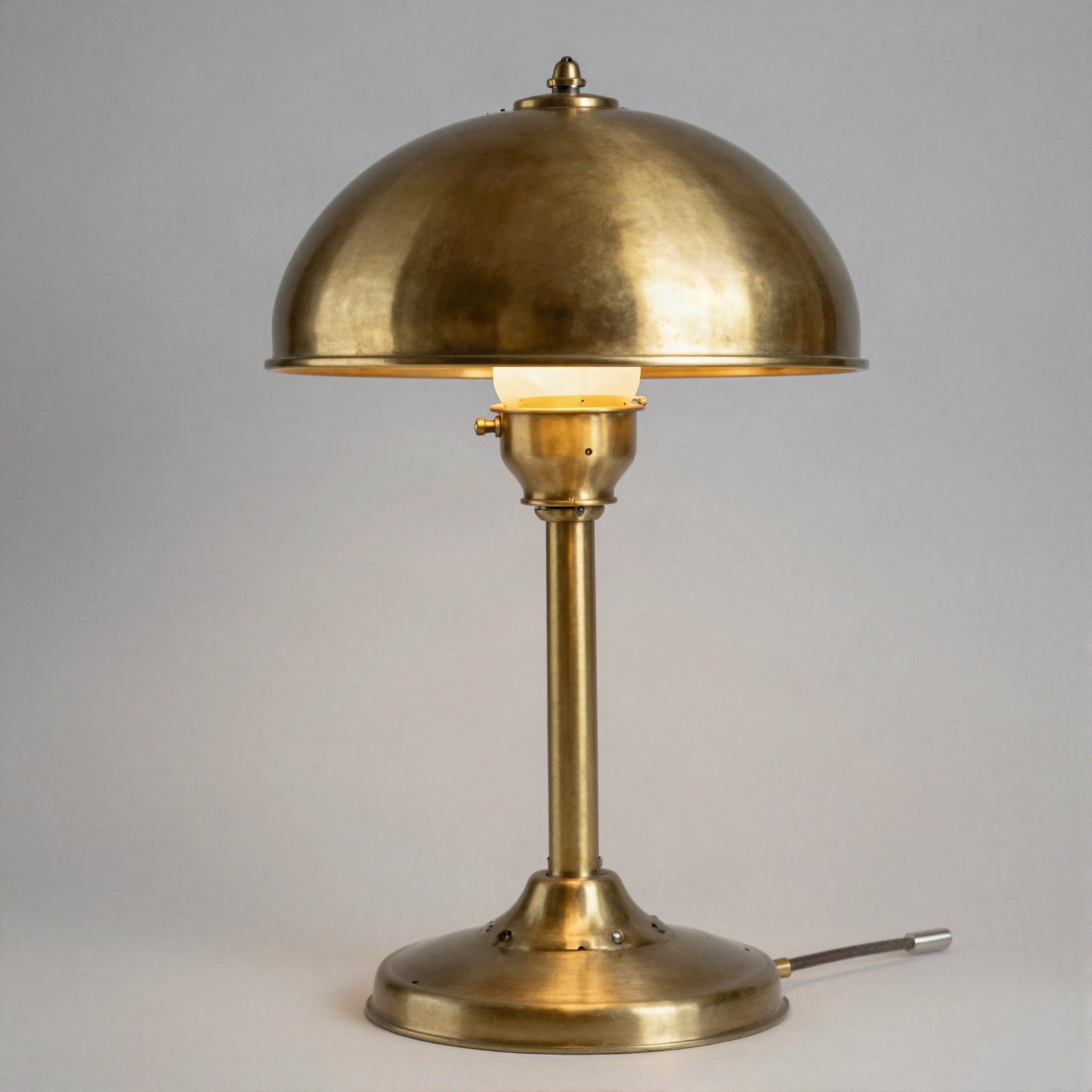 Brass table lamp with a dome shade
