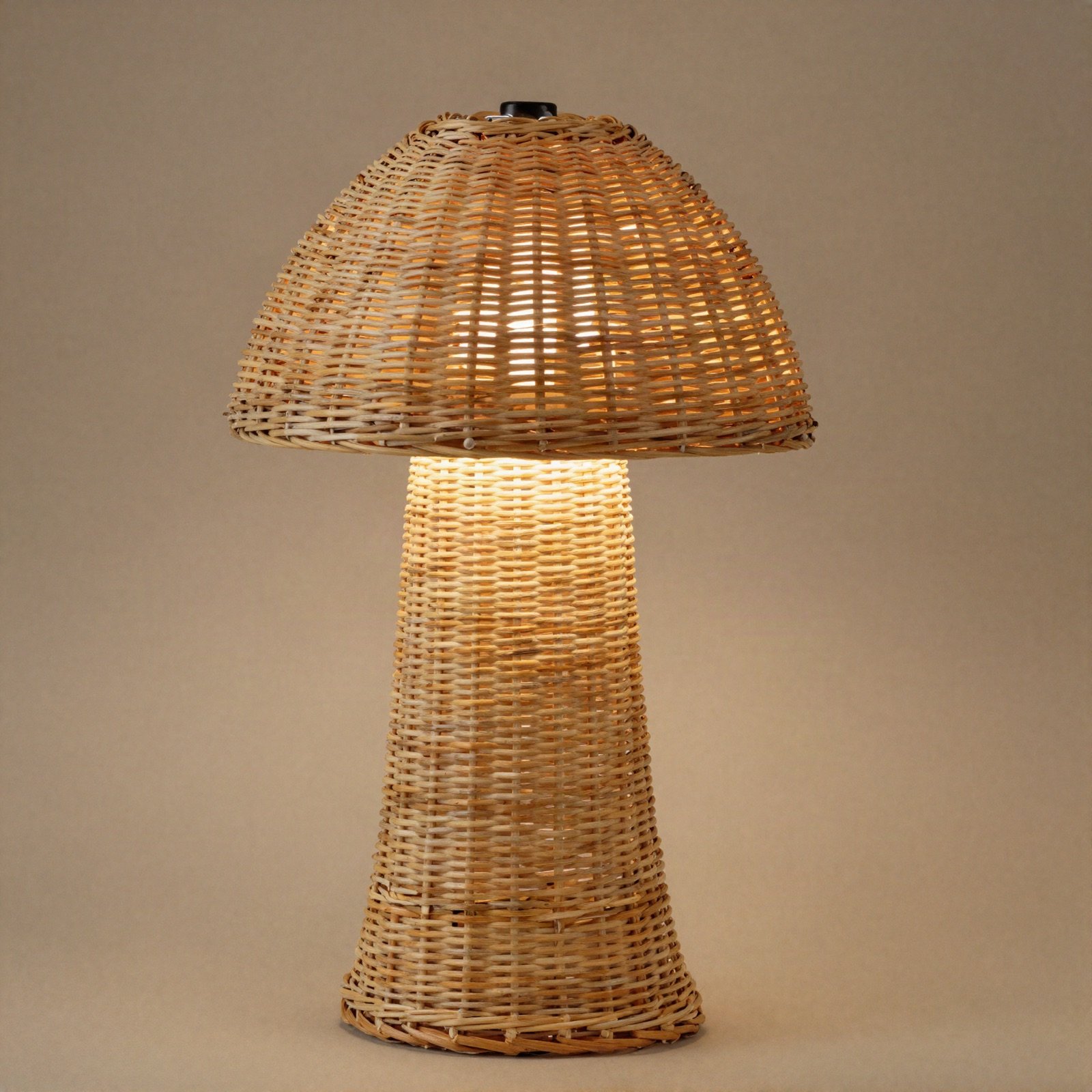 Woven rattan table lamp with a dome shade