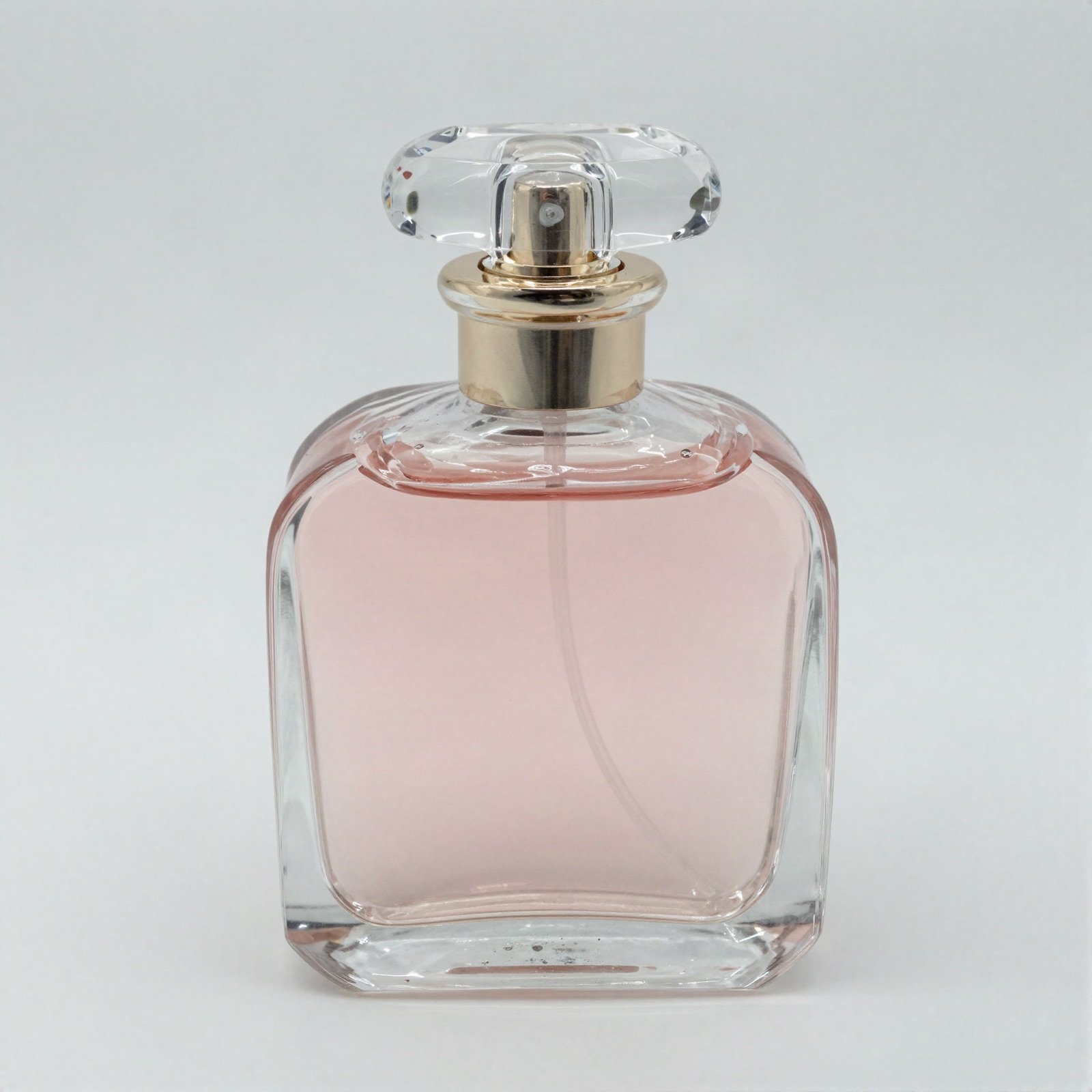 Blush pink perfume bottle with a crystal stopper