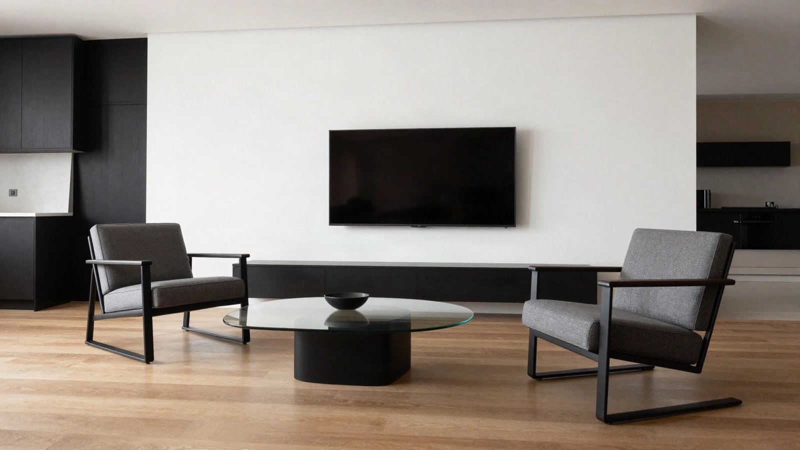 Minimal living room with two lounge chairs around a glass coffee table