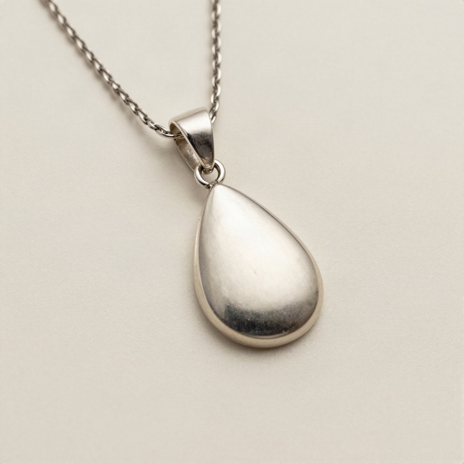Sterling silver teardrop pendant on a fine silver chain
