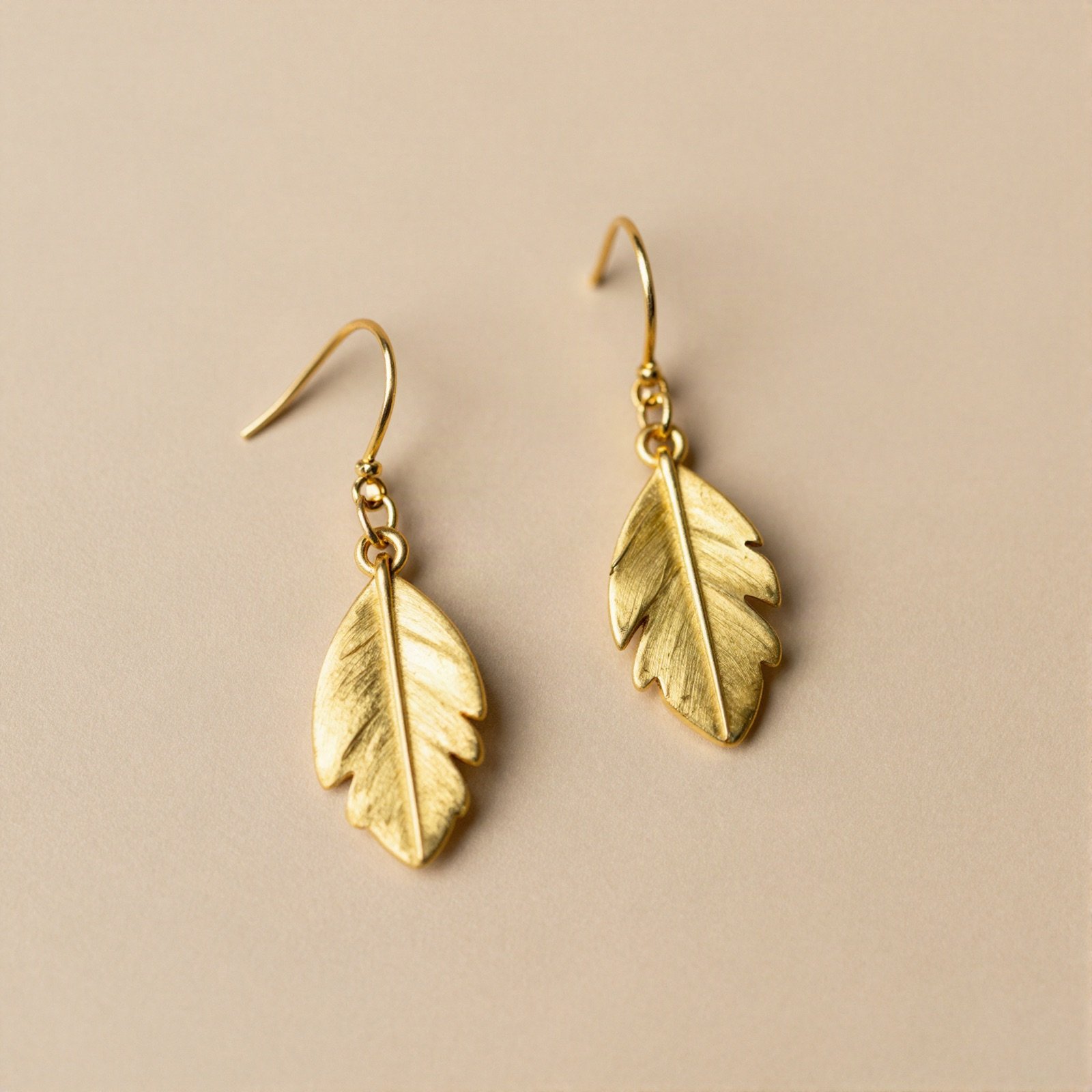 Gold leaf drop earrings on hooks