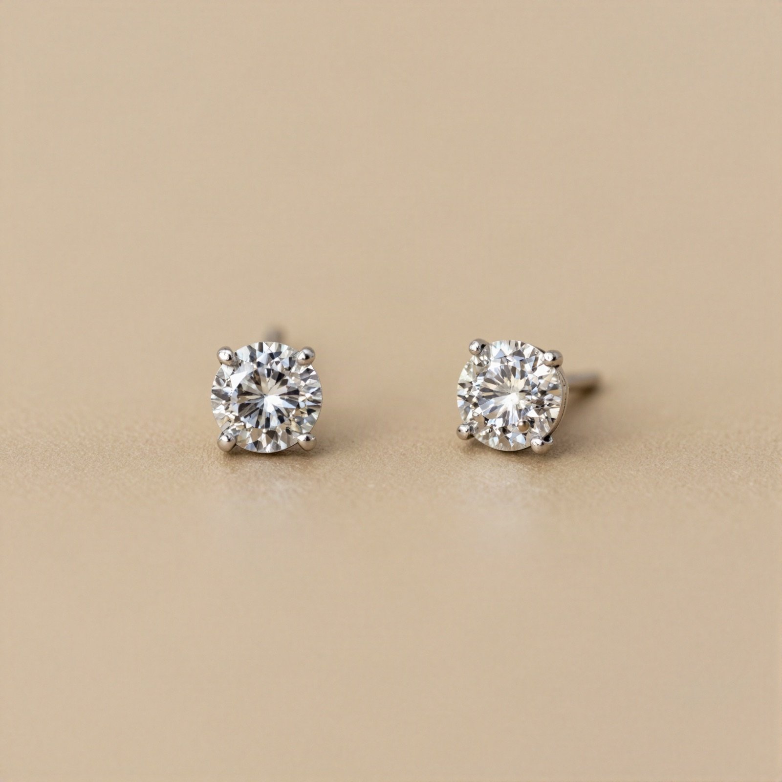 Pair of diamond stud earrings in white gold