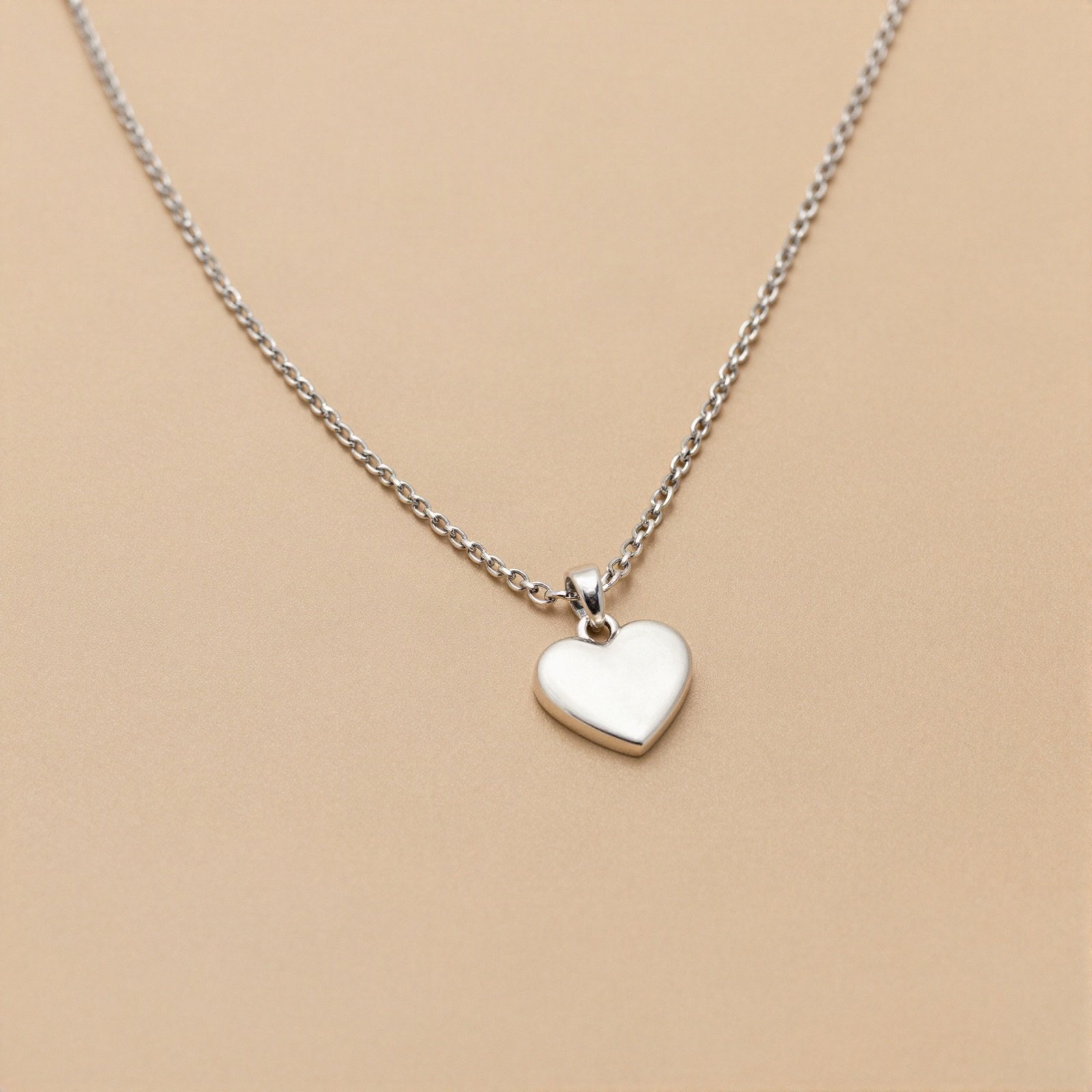 Silver chain necklace with a heart pendant