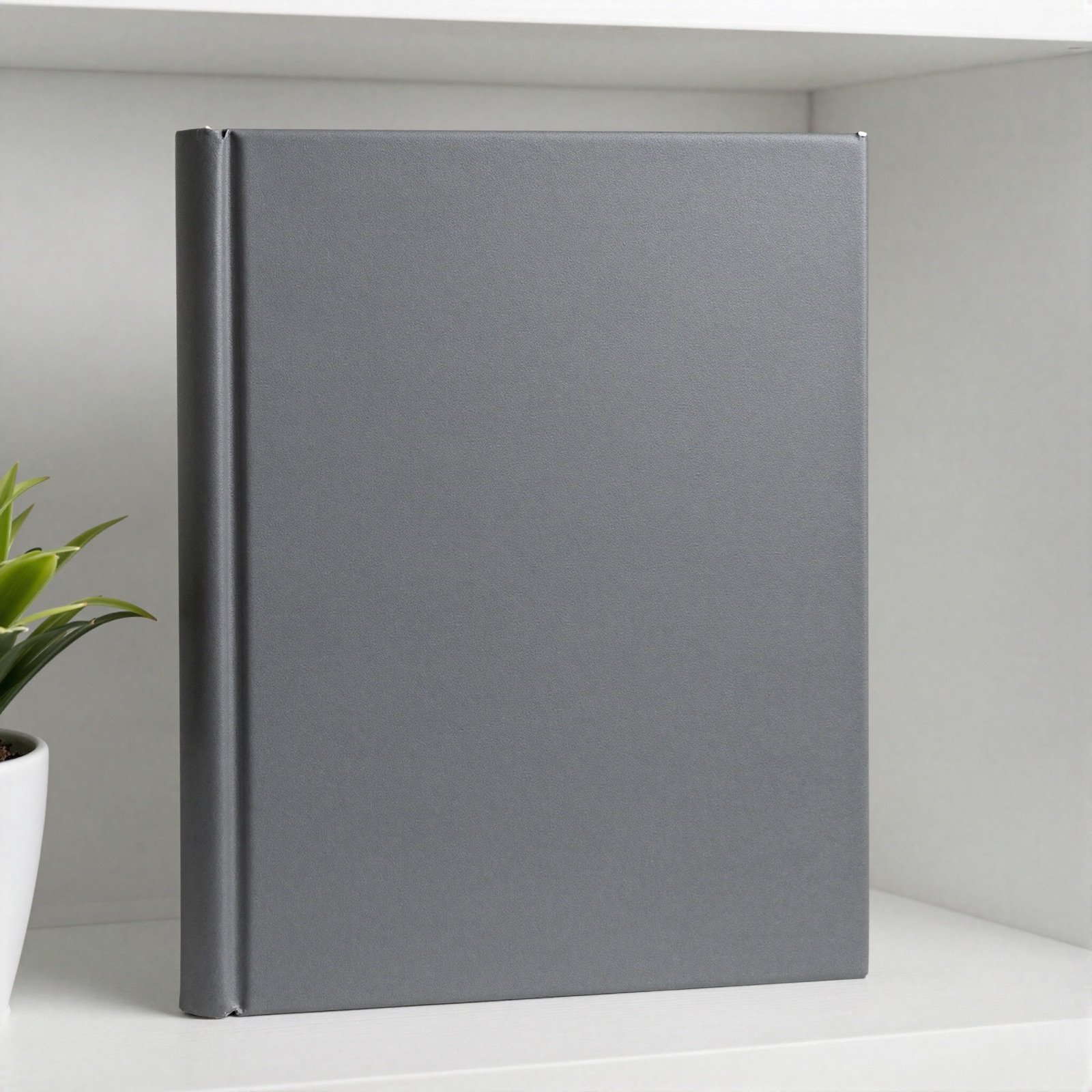 A charcoal hardcover handbook standing on a shelf