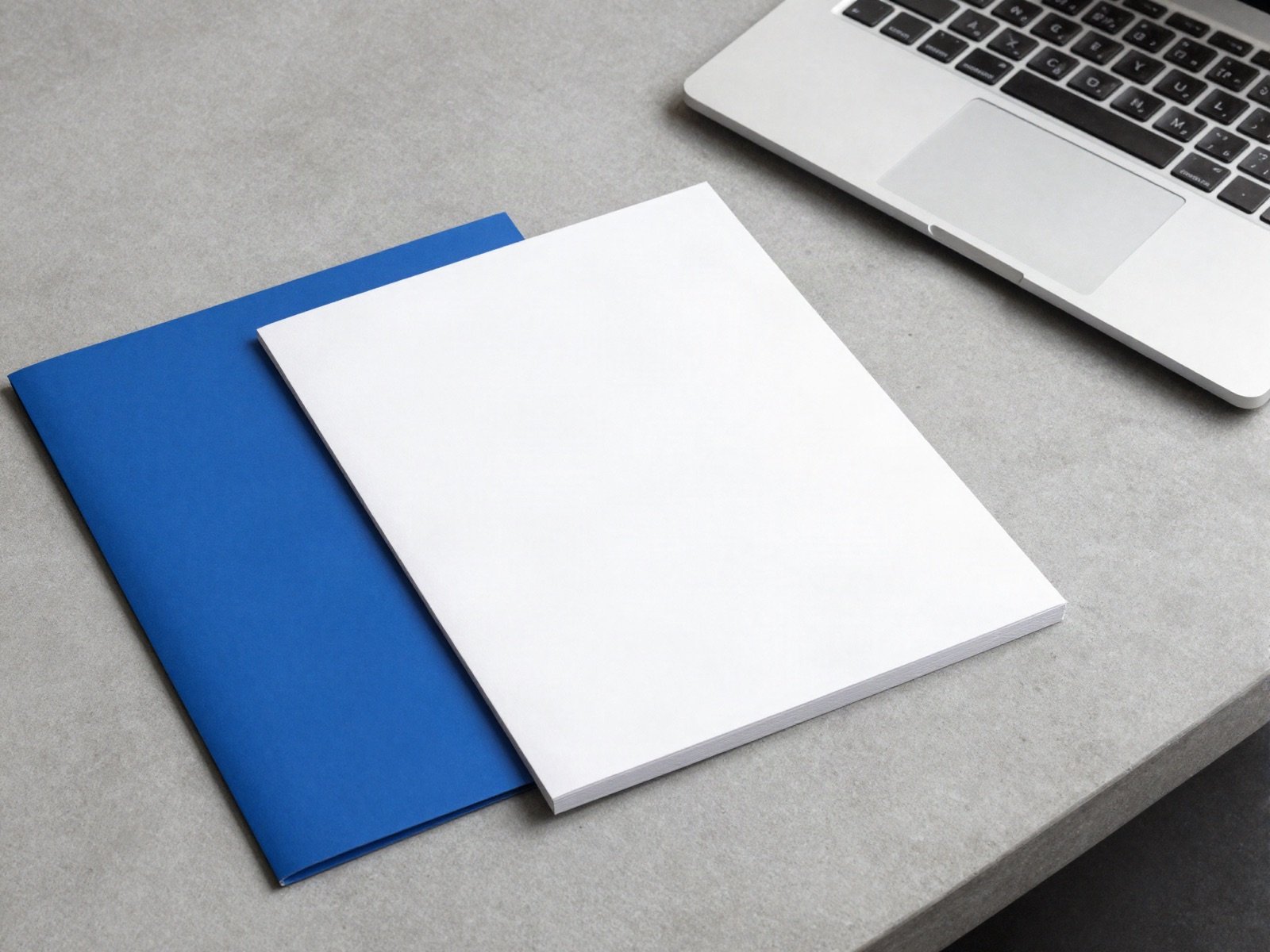 Unbranded stationery and a laptop for an engineering firm identity project