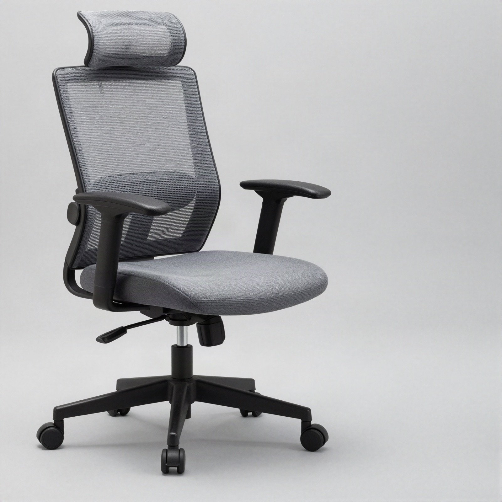 A grey mesh ergonomic executive chair with headrest