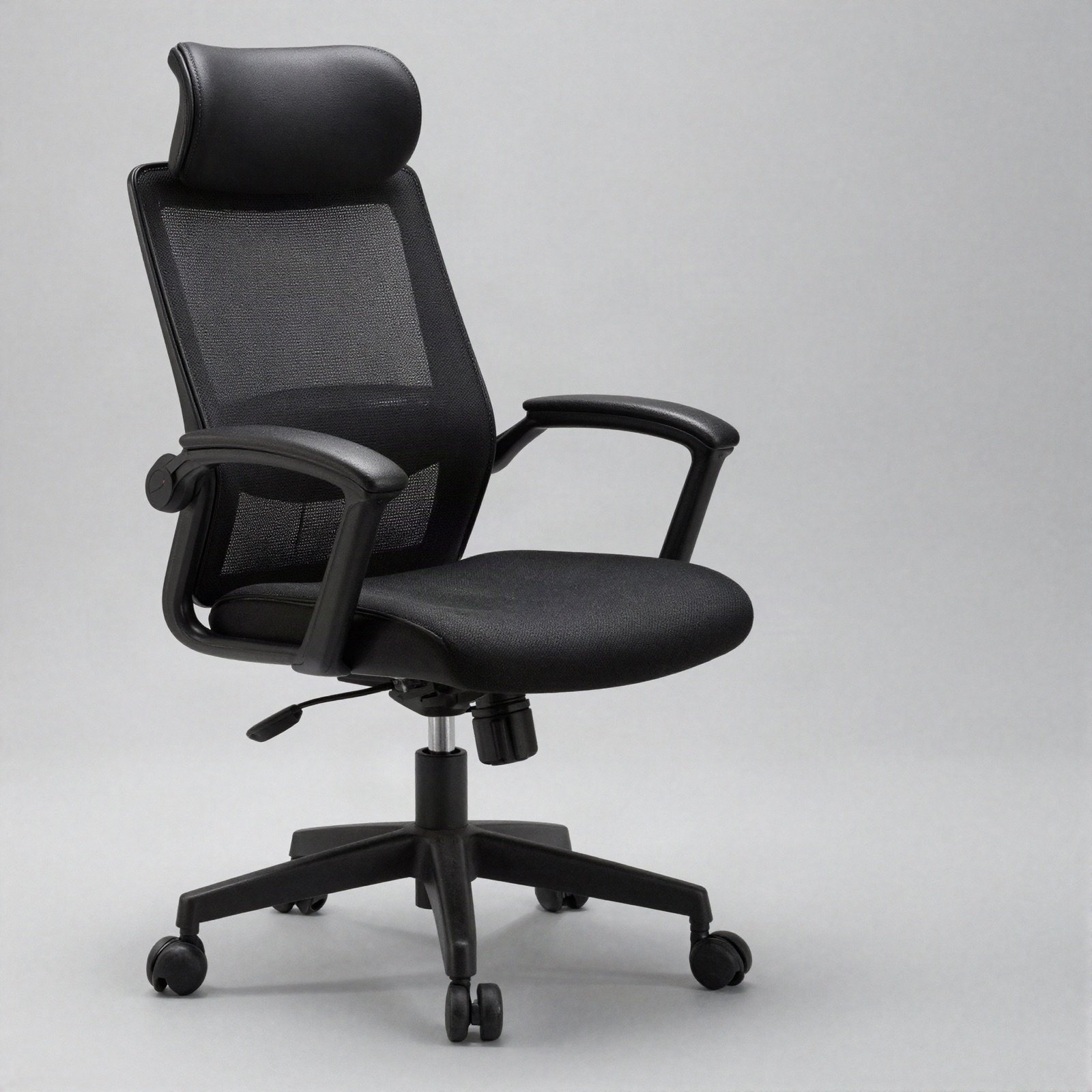 An all-black executive office chair with headrest