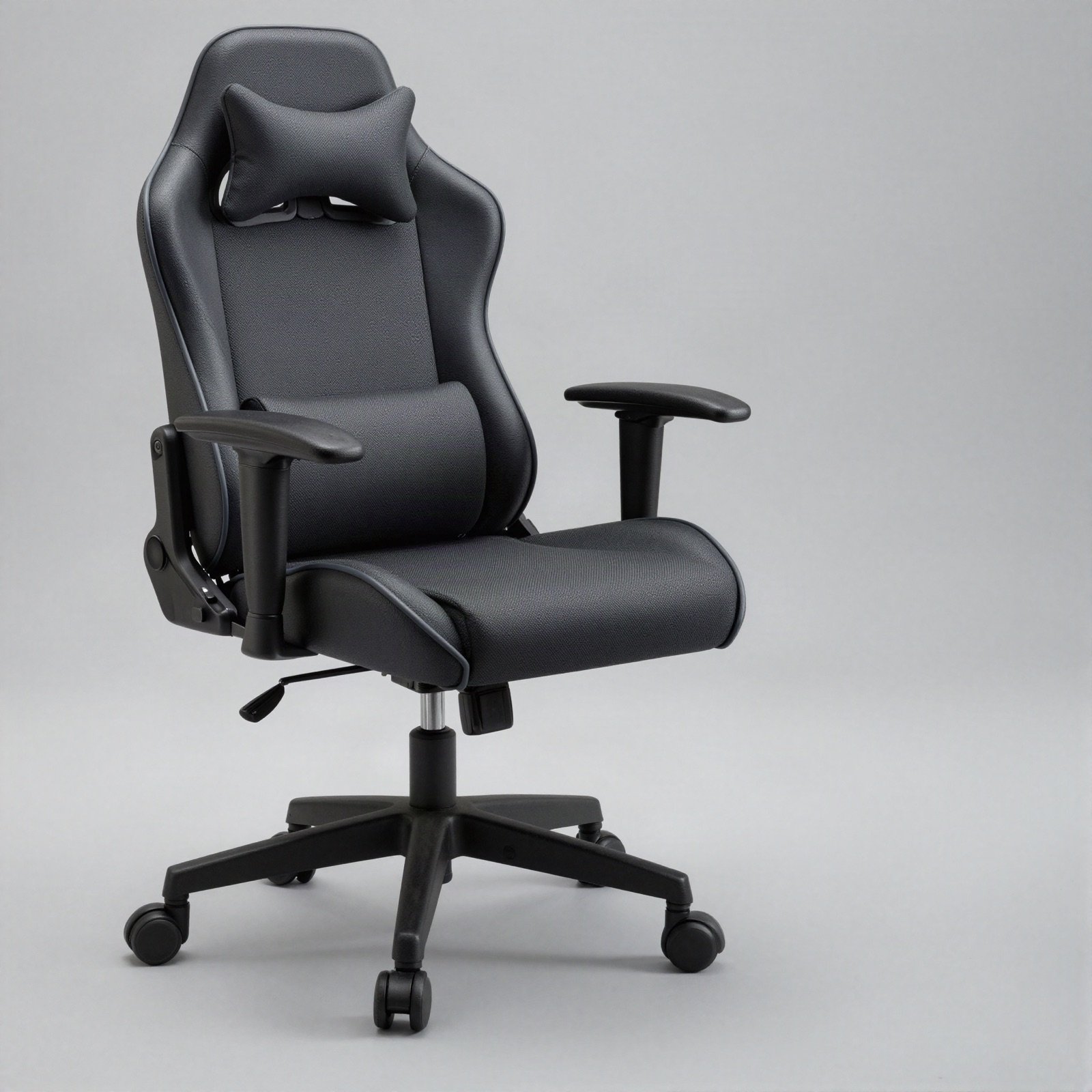 A dark grey high-back gaming chair with cushions