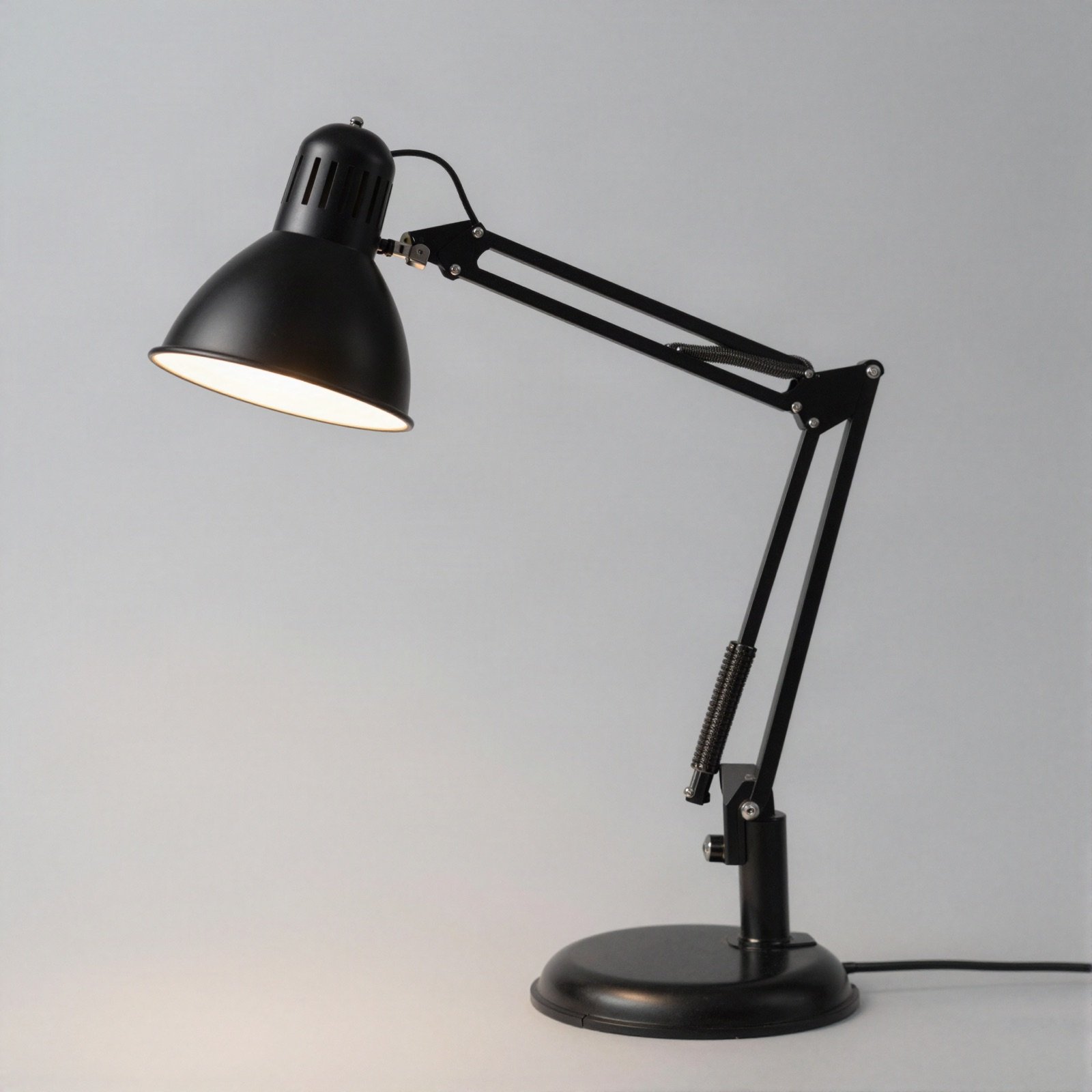 A black adjustable steel desk lamp