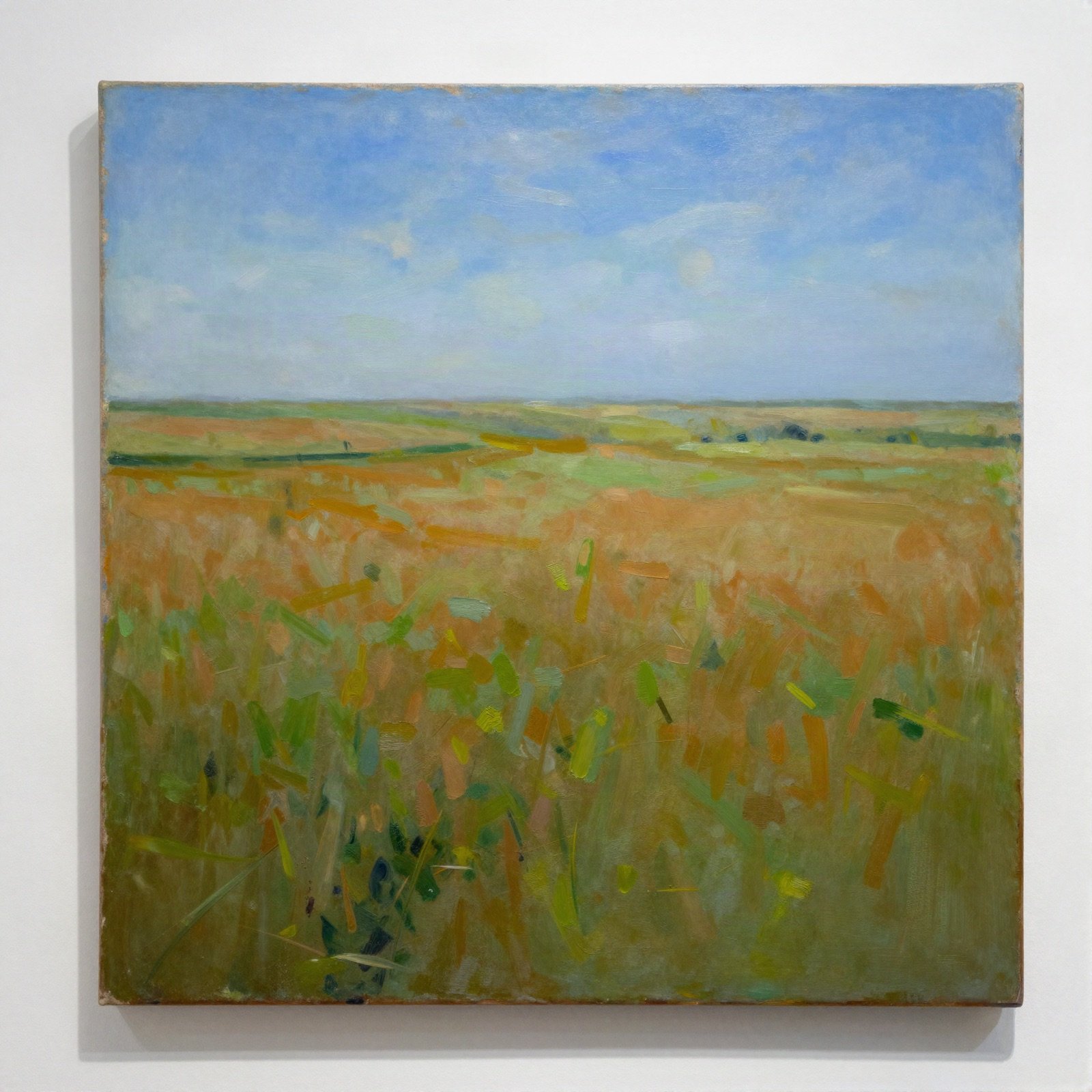 Impasto landscape of a green and ochre field under a blue sky