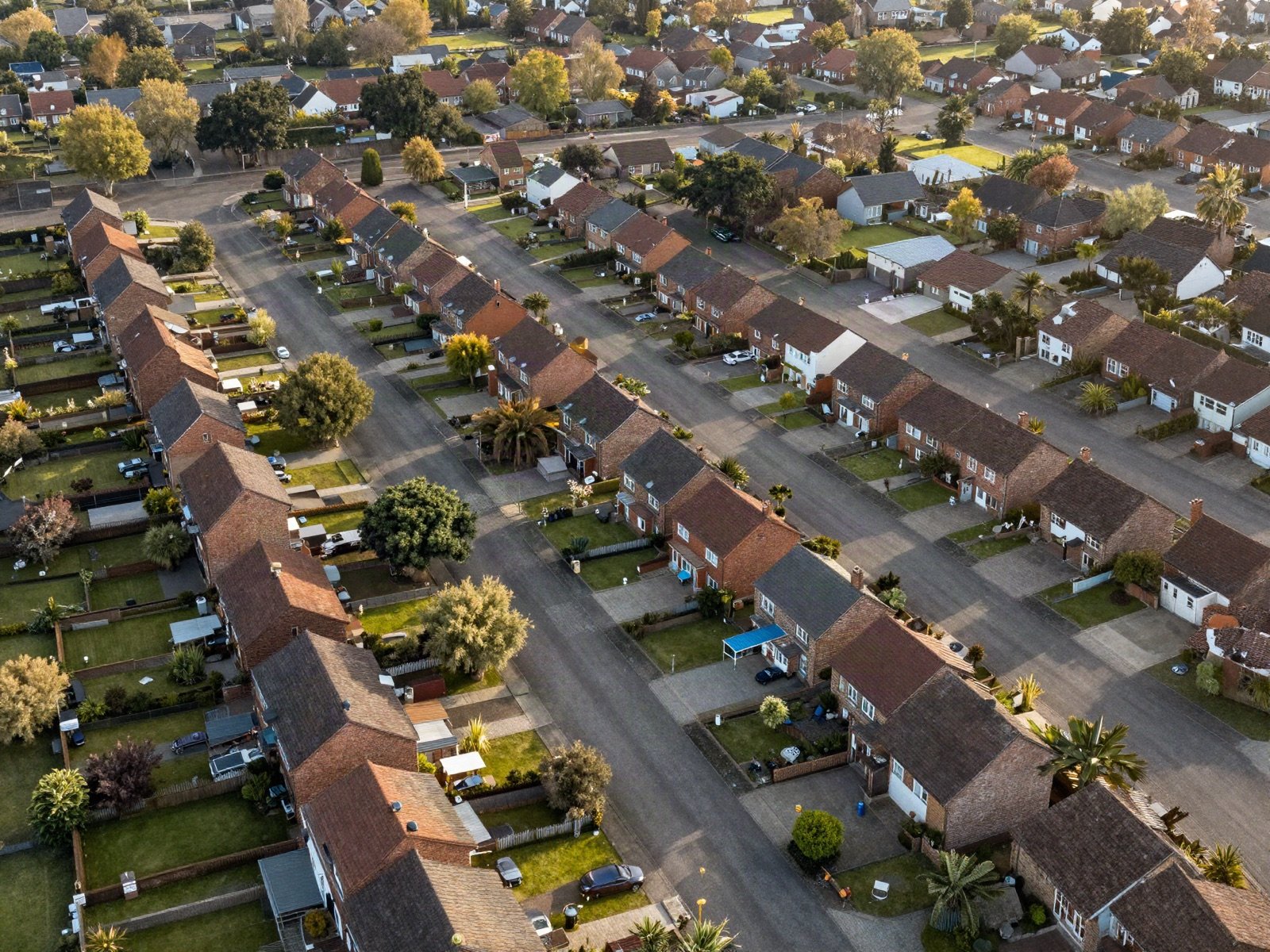 An aerial view of a suburban neighbourhood with rows of houses