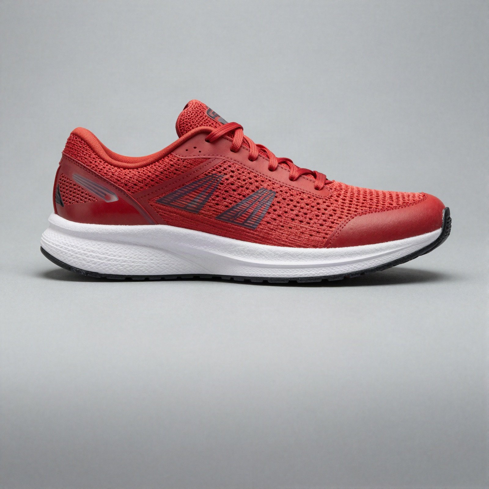 A red knit running shoe with a white sole