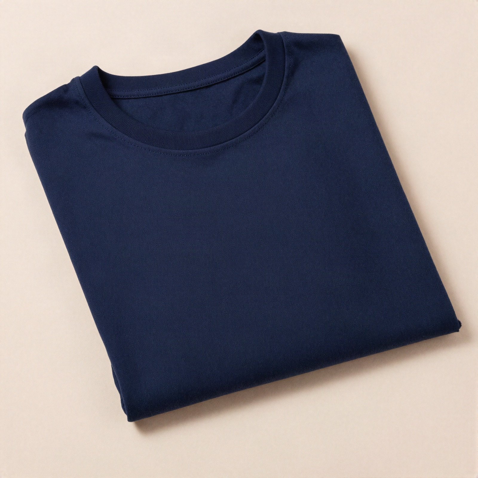 Folded plain navy blue cotton t-shirt
