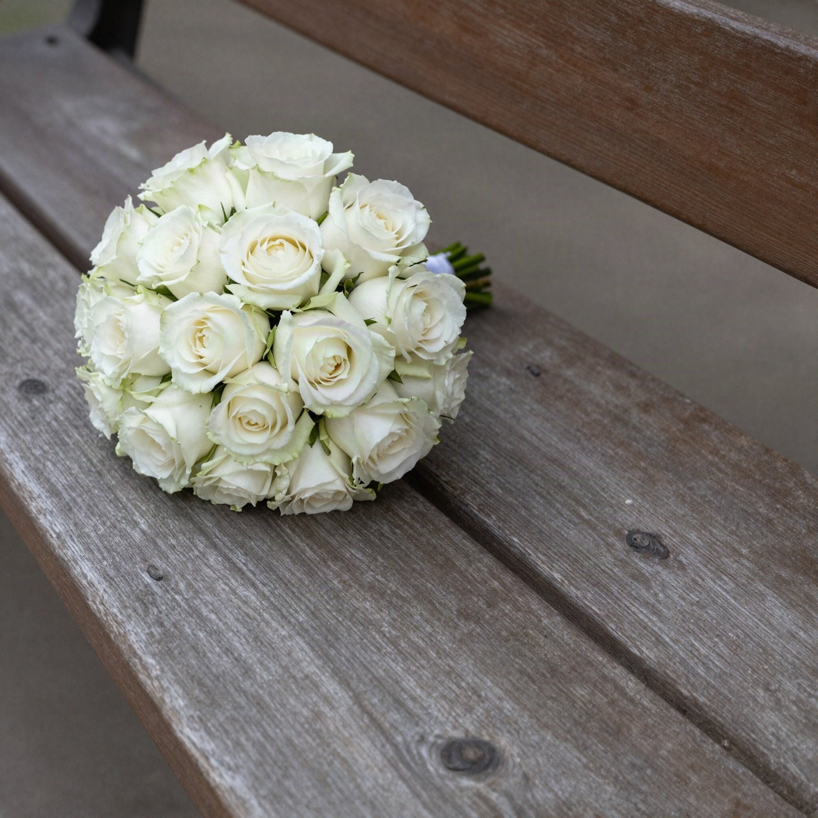 Bridal bouquet on a wooden bench